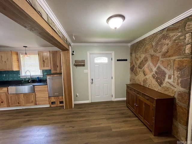 3804 Ridge Rd, North Little Rock, AR 72116 - entrance foyer with ornamental molding, dark wood-style flooring, and baseboards