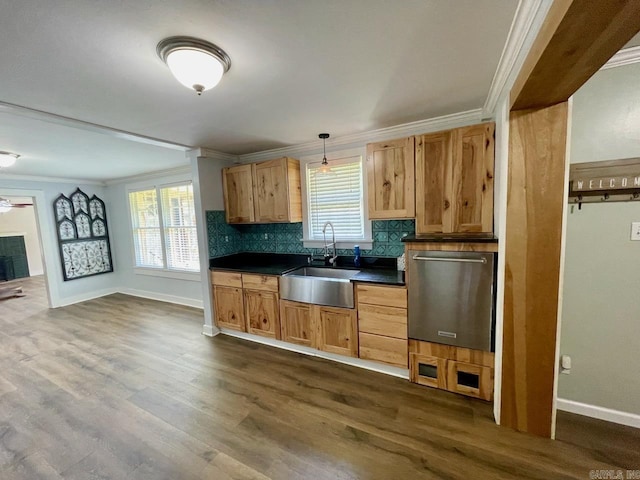 3804 Ridge Rd, North Little Rock, AR 72116 - kitchen featuring a sink, ornamental molding, dark countertops, dishwasher, and baseboards