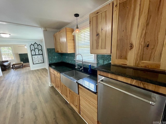 3804 Ridge Rd, North Little Rock, AR 72116 - kitchen with dishwasher, a sink, dark countertops, crown molding, and wood finished floors