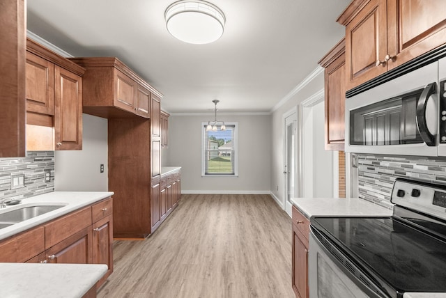 8001 Mars Hill Rd, Bauxite, AR 72011 - kitchen with stainless steel appliances, light countertops, brown cabinets, and crown molding