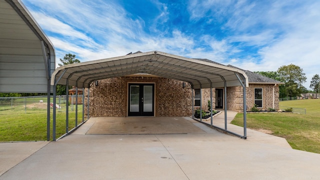 8001 Mars Hill Rd, Bauxite, AR 72011 - view of front facade featuring french doors, a detached carport, brick siding, and concrete driveway
