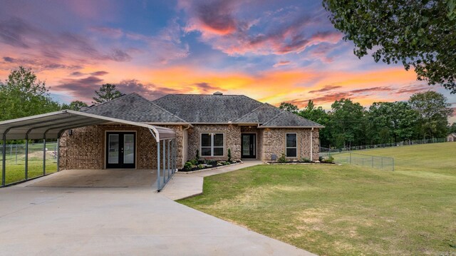 8001 Mars Hill Rd, Bauxite, AR 72011 - view of front of house featuring french doors, brick siding, concrete driveway, a carport, and a shingled roof