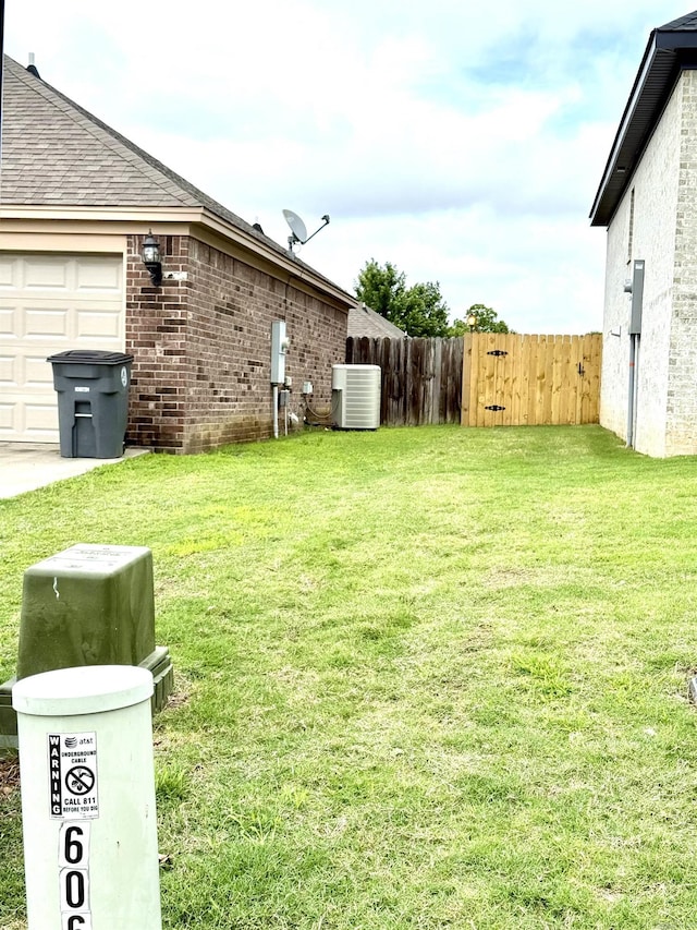 604 Samuel Loyce Dr, Searcy, AR 72143 - view of yard with cooling unit and a garage
