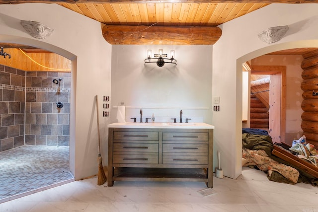10836 Bray Rd, Elkins, AR 72727 - full bath featuring log walls, tiled shower, wooden ceiling, and double vanity