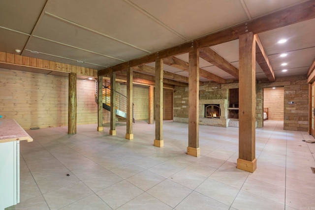 10836 Bray Rd, Elkins, AR 72727 - finished below grade area featuring an outdoor stone fireplace, stairs, and brick wall
