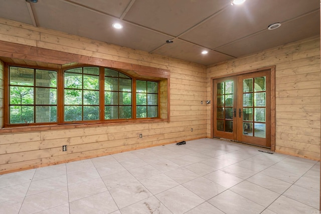 10836 Bray Rd, Elkins, AR 72727 - unfurnished room featuring french doors, healthy amount of natural light, wood walls, recessed lighting, and light floors