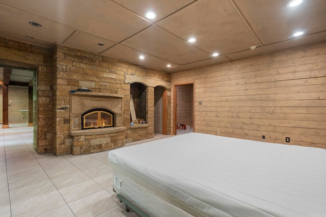 10836 Bray Rd, Elkins, AR 72727 - bedroom featuring light tile patterned floors, a glass covered fireplace, and recessed lighting