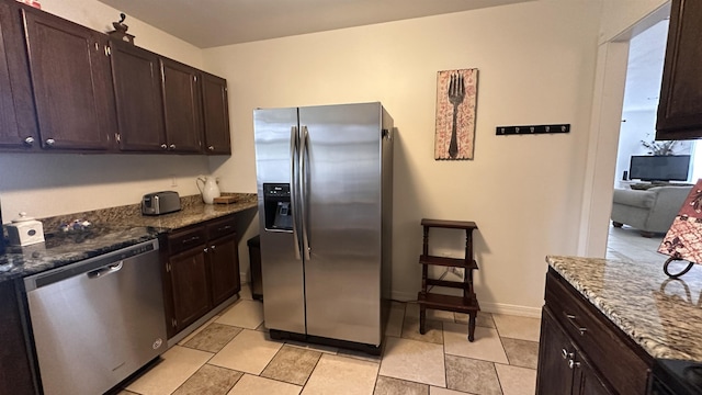 21 Sharp St, Ash Flat, AR 72513 - kitchen with appliances with stainless steel finishes, dark stone countertops, and dark brown cabinets
