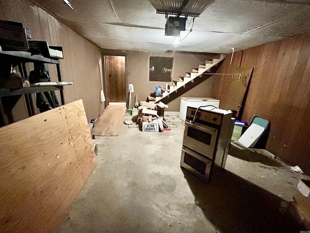 4109 Garrison Rd, Little Rock, AR 72223 - garage featuring wooden walls and a garage door opener