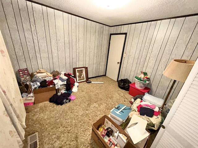 4109 Garrison Rd, Little Rock, AR 72223 - unfurnished bedroom with carpet flooring, a textured ceiling, and wood walls