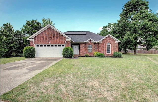 76 Woodridge Dr, Little Rock, AR 72204 - view of front of property with brick siding, a garage, solar panels, and driveway