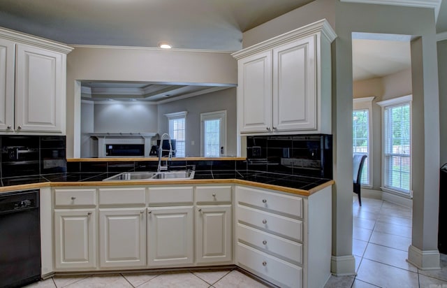 76 Woodridge Dr, Little Rock, AR 72204 - kitchen featuring black dishwasher, a sink, decorative backsplash, plenty of natural light, and crown molding
