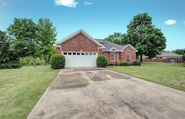 76 Woodridge Dr, Little Rock, AR 72204 - view of front of property featuring brick siding, a garage, concrete driveway, and solar panels