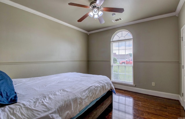 76 Woodridge Dr, Little Rock, AR 72204 - bedroom featuring baseboards, wood finished floors, crown molding, and a ceiling fan
