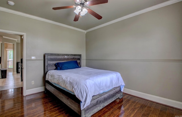76 Woodridge Dr, Little Rock, AR 72204 - bedroom with crown molding, baseboards, wood finished floors, and ceiling fan