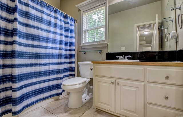76 Woodridge Dr, Little Rock, AR 72204 - bathroom with tile patterned flooring, toilet, vanity, and a shower with shower curtain