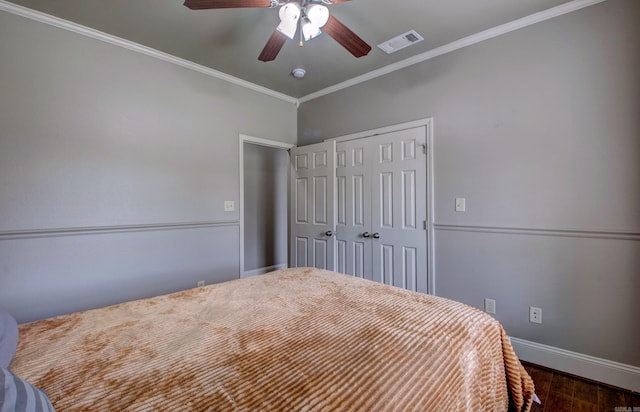 76 Woodridge Dr, Little Rock, AR 72204 - bedroom featuring baseboards, dark wood-style floors, ornamental molding, a closet, and a ceiling fan