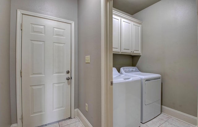 76 Woodridge Dr, Little Rock, AR 72204 - laundry room featuring cabinet space, separate washer and dryer, light tile patterned floors, and baseboards