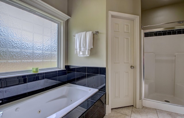 76 Woodridge Dr, Little Rock, AR 72204 - full bathroom with a stall shower, a tub with jets, and tile patterned flooring