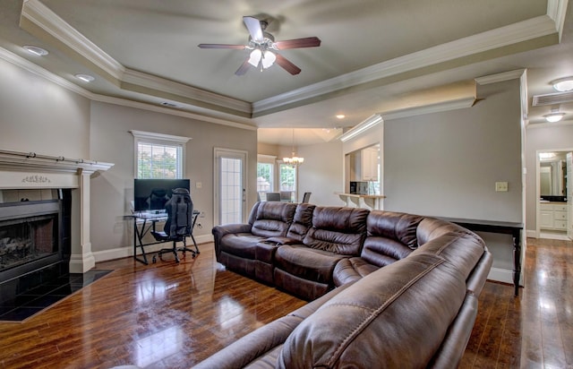 76 Woodridge Dr, Little Rock, AR 72204 - living area with a raised ceiling, hardwood / wood-style flooring, ceiling fan, a chandelier, and ornamental molding