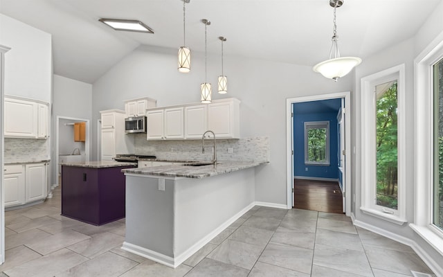 74 Medina Way, Hot Springs Village, AR 71909 - kitchen with a sink, stainless steel appliances, tasteful backsplash, light stone counters, and high vaulted ceiling