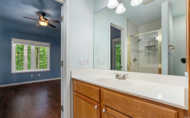 74 Medina Way, Hot Springs Village, AR 71909 - full bathroom featuring a shower stall, vanity, wood finished floors, a ceiling fan, and baseboards