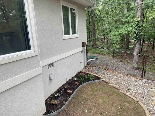 74 Medina Way, Hot Springs Village, AR 71909 - view of side of property featuring stucco siding