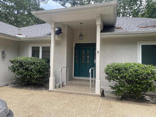 74 Medina Way, Hot Springs Village, AR 71909 - entrance to property featuring roof with shingles and stucco siding