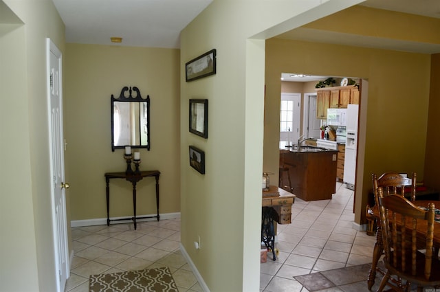 1005 Georgia Ridge Rd, Searcy, AR 72143 - hall with a sink, light tile patterned flooring, and baseboards