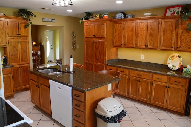 1005 Georgia Ridge Rd, Searcy, AR 72143 - kitchen with white dishwasher, a sink, brown cabinetry, and recessed lighting