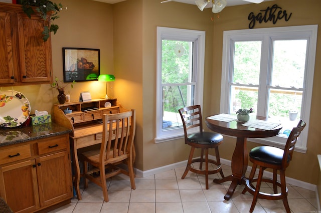 1005 Georgia Ridge Rd, Searcy, AR 72143 - dining area with baseboards, a ceiling fan, and light tile patterned floors
