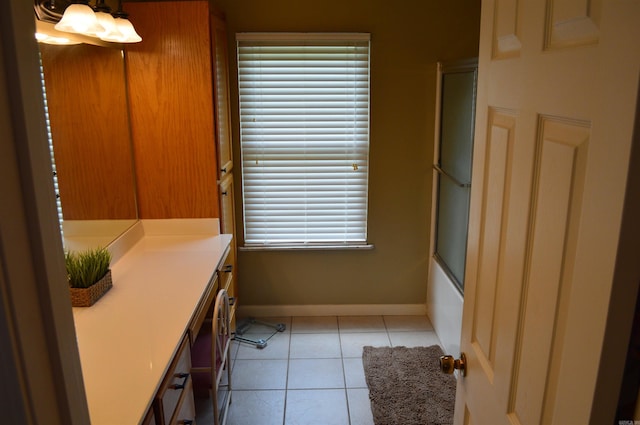 1005 Georgia Ridge Rd, Searcy, AR 72143 - full bathroom featuring vanity, baseboards, tile patterned flooring, shower / bath combination with glass door, and plenty of natural light