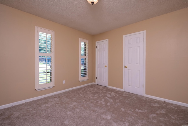 8116 Depriest Rd, Little Rock, AR 72103 - unfurnished bedroom with carpet floors, baseboards, and a textured ceiling