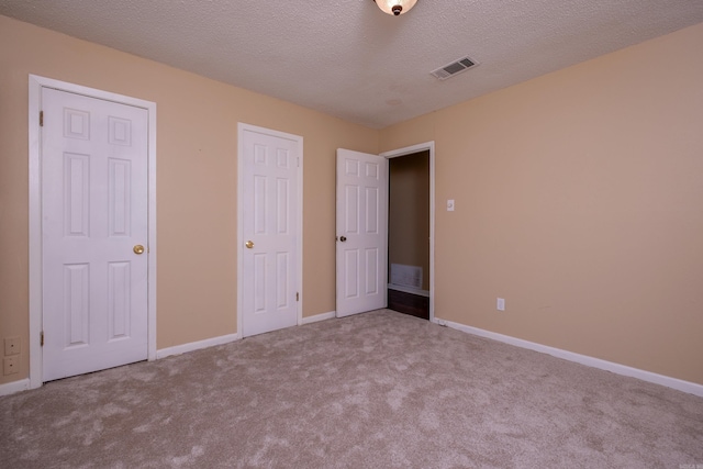 8116 Depriest Rd, Little Rock, AR 72103 - unfurnished bedroom with carpet floors, baseboards, and a textured ceiling