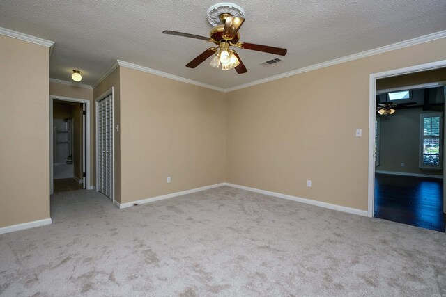 8116 Depriest Rd, Little Rock, AR 72103 - spare room with a ceiling fan, carpet floors, ornamental molding, baseboards, and a textured ceiling