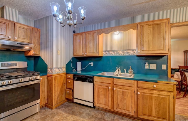 32 Bonnie Park Dr, Pine Bluff, AR 72601 - kitchen featuring stainless steel range with gas stovetop, dishwasher, under cabinet range hood, a sink, and a textured ceiling