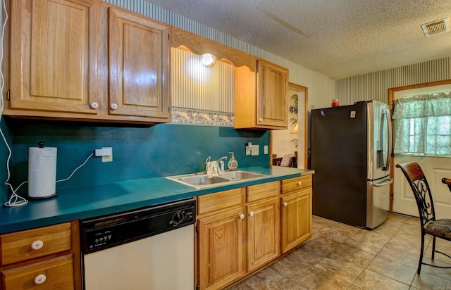 32 Bonnie Park Dr, Pine Bluff, AR 72601 - kitchen featuring stainless steel fridge, dishwasher, a sink, a textured ceiling, and wallpapered walls