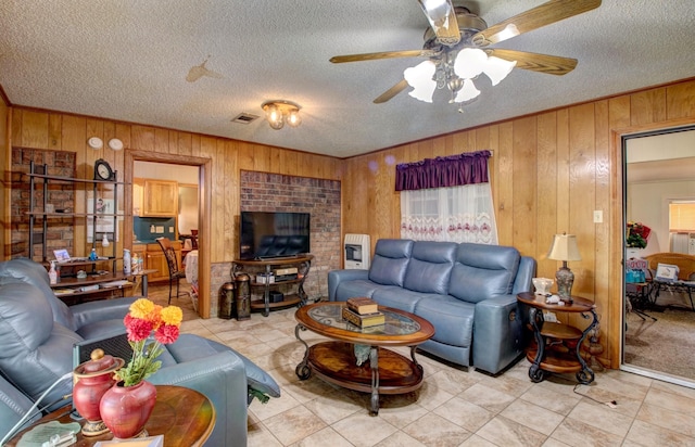 32 Bonnie Park Dr, Pine Bluff, AR 72601 - tiled living room with wood walls, a textured ceiling, ceiling fan, and ornamental molding