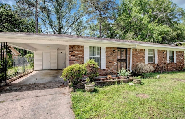 32 Bonnie Park Dr, Pine Bluff, AR 72601 - ranch-style home featuring driveway, brick siding, and a carport