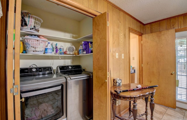 32 Bonnie Park Dr, Pine Bluff, AR 72601 - laundry room featuring separate washer and dryer, crown molding, wooden walls, a textured ceiling, and light tile patterned floors