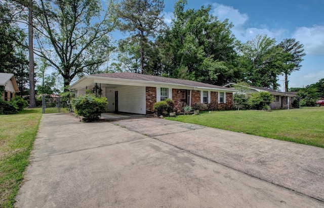 32 Bonnie Park Dr, Pine Bluff, AR 72601 - single story home with driveway, a front yard, brick siding, and an attached carport