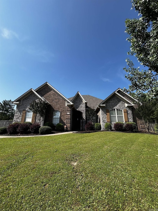 11907 Stonegate, Alexander, AR 72002 - view of front of house featuring a front yard and brick siding