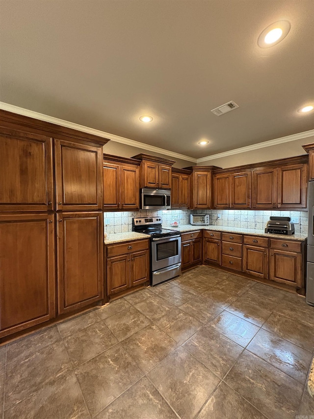 11907 Stonegate, Alexander, AR 72002 - kitchen featuring stainless steel appliances, backsplash, ornamental molding, recessed lighting, and light stone counters