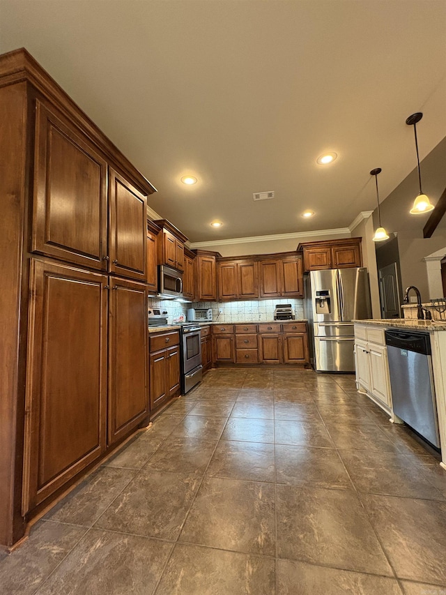 11907 Stonegate, Alexander, AR 72002 - kitchen featuring appliances with stainless steel finishes, tasteful backsplash, ornamental molding, pendant lighting, and a sink