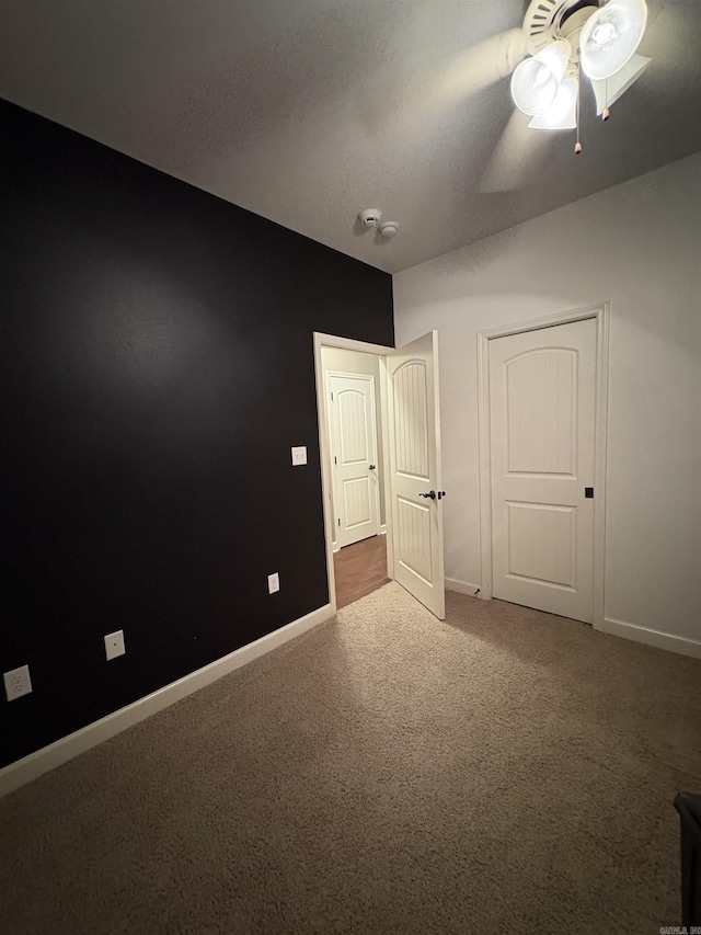 11907 Stonegate, Alexander, AR 72002 - unfurnished bedroom with carpet floors, baseboards, and ceiling fan