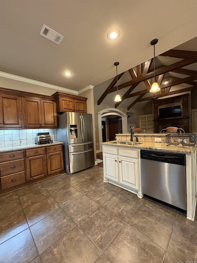 11907 Stonegate, Alexander, AR 72002 - kitchen featuring stainless steel appliances, arched walkways, a sink, ornamental molding, and pendant lighting