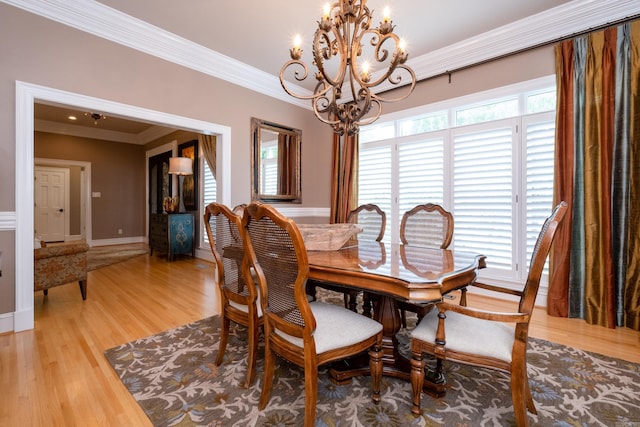 18 Chenal Cir, Little Rock, AR 72223 - dining space with a chandelier, crown molding, light wood finished floors, and baseboards