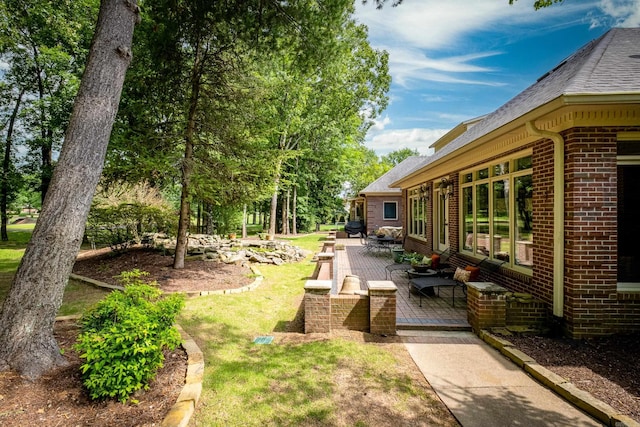 18 Chenal Cir, Little Rock, AR 72223 - view of grassy yard with a patio area