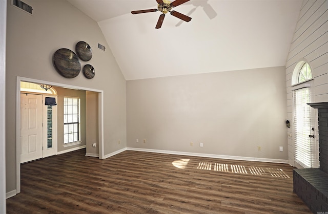 1309 Frontier, White Hall, AR 71602 - unfurnished living room featuring vaulted ceiling, ceiling fan, a fireplace, wood finished floors, and baseboards