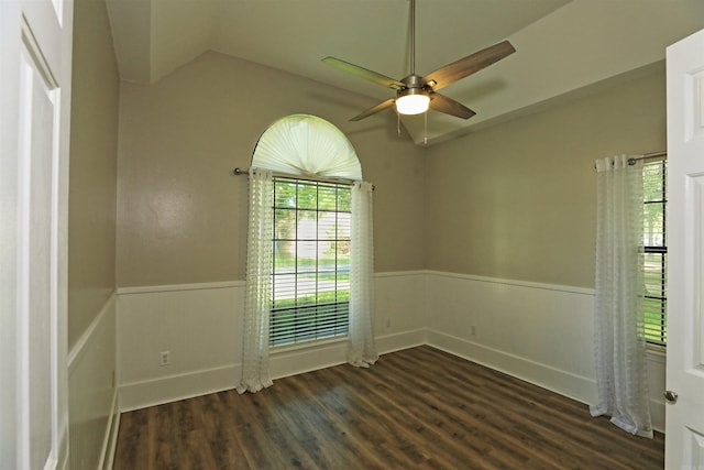 1309 Frontier, White Hall, AR 71602 - spare room with lofted ceiling, ceiling fan, wainscoting, and dark wood finished floors